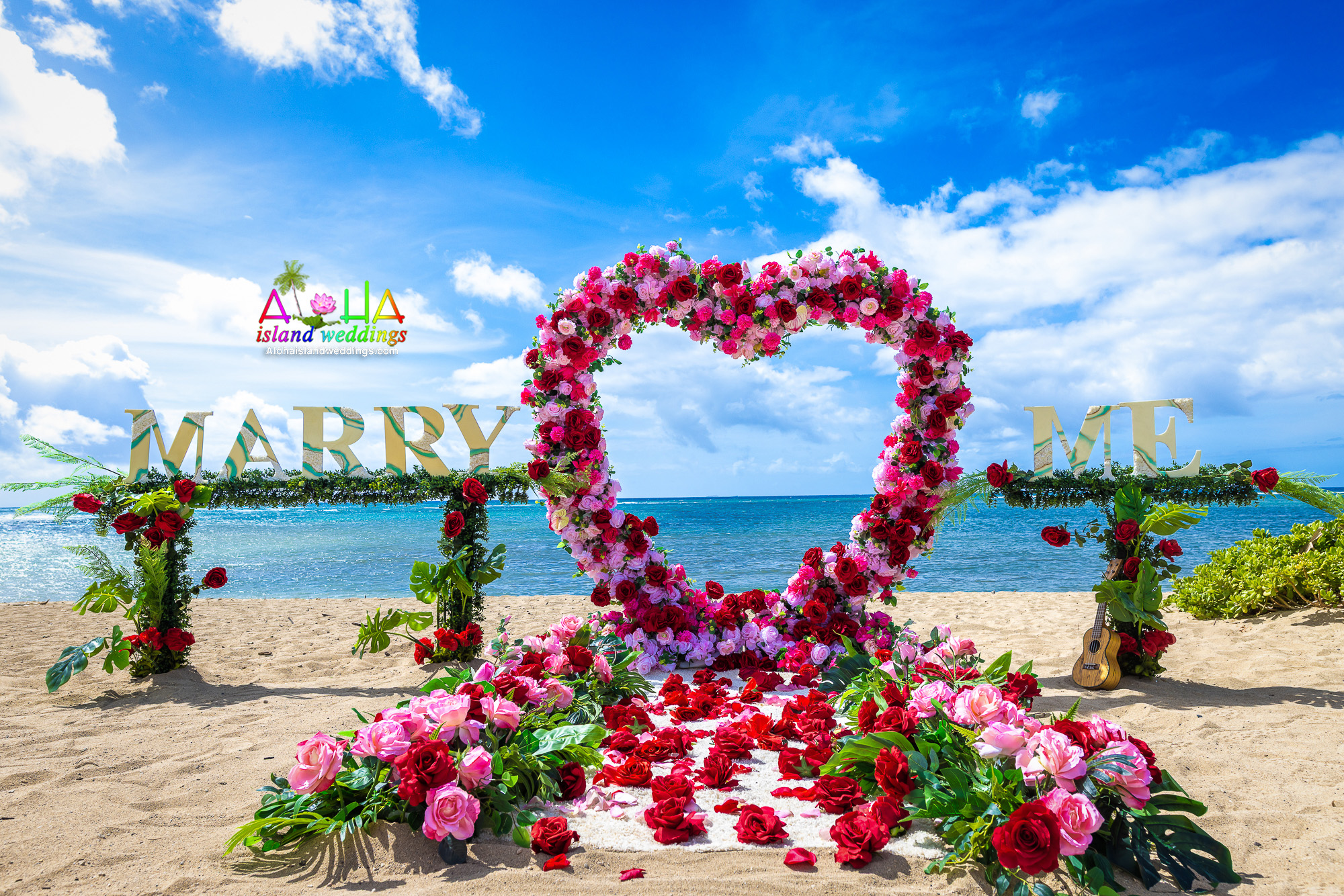 Red rose heart with a Marry Me sign for a beach proposal in Hawaii